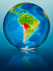 Bolivia on Earth on reflective surface