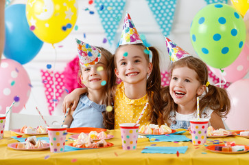children's birthday. happy kids with cake
