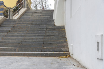 Marble damage and dirty stairs with whitehouse wall in the city