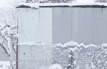 Metallic shack in a snowy day (Pesaro, Italy)