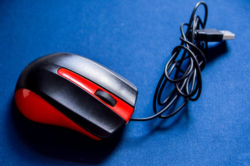mouse lies on the rug, the user clicks on the mouse with a computer