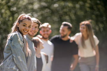 handsome young man in front of his friends