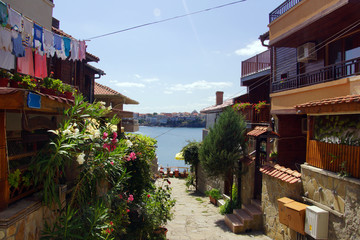 a view of the sea through the old street of Sozopol, Bulgaria