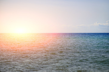 the blue ocean with dull clouds on a lovely sunny day