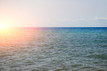 the blue ocean with dull clouds on a lovely sunny day