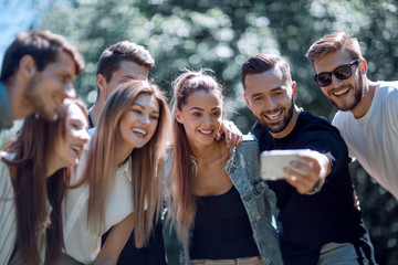 group of friends taking selfies in the Park