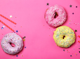 Donuts on a pink background. Birthday.