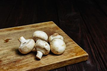 champignons on a wooden background