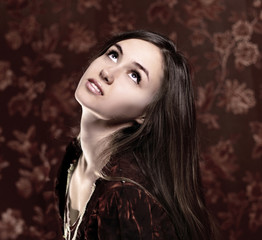 beautiful young woman on a dark background