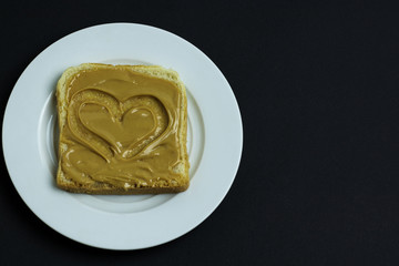 slice of fresh bread with peanut butter