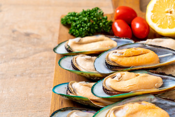 fresh mussel on wood board