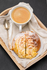 portuguese sweet bread pao de deus with cup of coffee