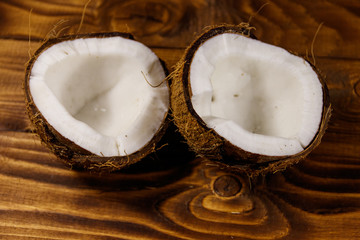 Fresh ripe coconut on rustic wooden table