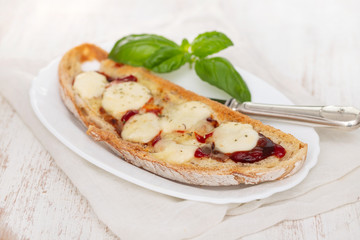 toast with sauce and cheese on white dish