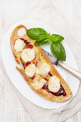 toast with sauce and cheese on white dish