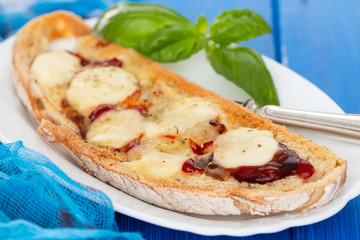 toast with sauce and cheese on white dish