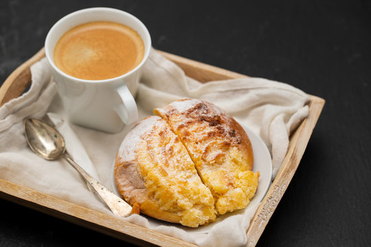 portuguese sweet bread pao de deus with cup of coffee