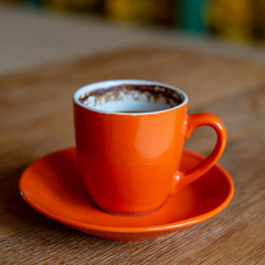 cup of coffee is on the table.