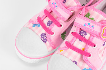 Fototapeta na wymiar Clothes, shoes, bags - Children pink sneakers