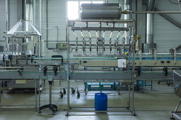 Fototapeta premium Water factory - Water bottling line for processing and bottling pure spring water into small bottles