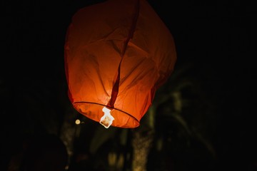 Thai lanterns thrown into the air at night