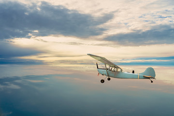 Old airplane on the blue sky	