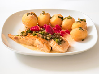 Frying salmon in cream sauce with beet and potatoes