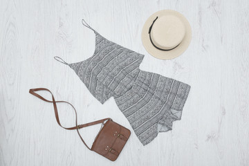 Summer romper, handbag and hat. Fashionable concept
