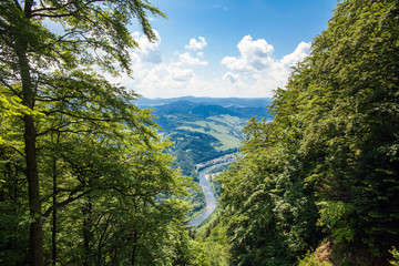View from the top of the mountain to the Sromowce village by the river. Bialy Dunajec in Pieniny, view from the top of the Three Crowns. The highest peak of the Pieniny, Trzy Korony. © Szymon Kaczmarczyk