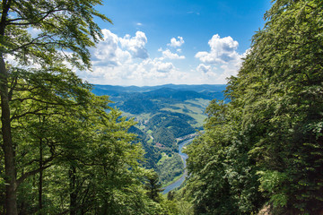 View from the top of the mountain to the Sromowce village by the river. Bialy Dunajec in Pieniny, view from the top of the Three Crowns. The highest peak of the Pieniny, Trzy Korony. © Szymon Kaczmarczyk