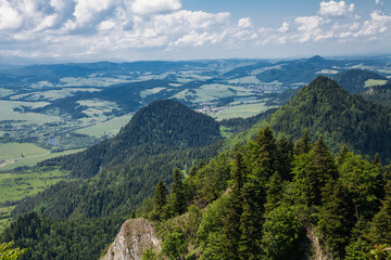 View from the top of the mountain to the Sromowce village by the river. Bialy Dunajec in Pieniny, view from the top of the Three Crowns. The highest peak of the Pieniny, Trzy Korony. © Szymon Kaczmarczyk