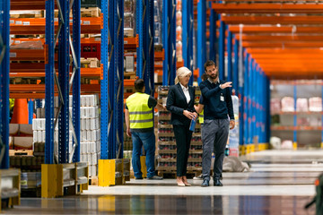 Managers walking through the warehouse