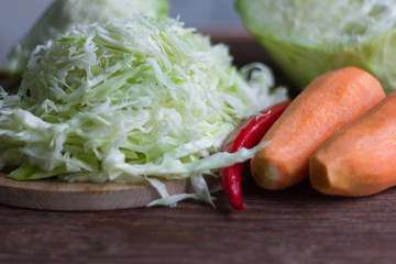 white cabbage cut into strips and carrots for cooking
