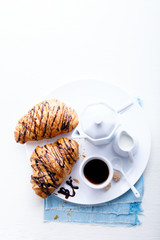 Croissant with Chocolate Espresso and milk Milk Tradition Morning Baking Sweet Dessert on the White Background Copy space for Text