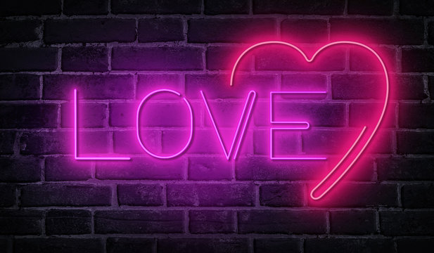 Word love written with neon letters at brick wall background