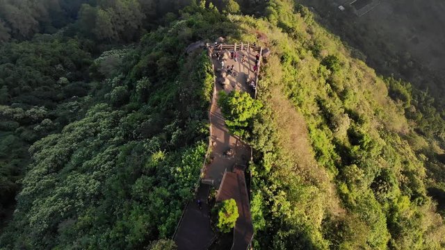 Ungraded Overhead Aerial Clip of Tebing Keraton Cliff in the Morning with foggy valley and lots of trees