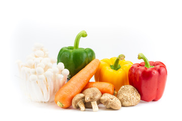 Group of fresh vegetables consisting of Shiitake mushrooms, shimeji mushrooms, carrots and bell peppers on white background