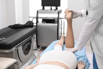 Fototapeta premium Orthopedist examining patient in hospital