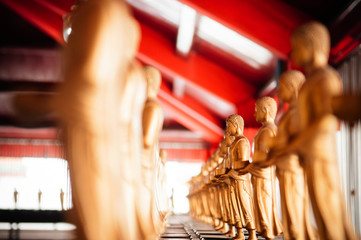 Small golden Buddha sculptures at Wat Phra Mahathat Nakhon Si Thammarat, Thailand