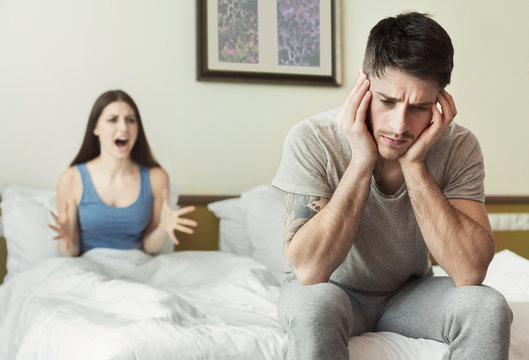 Young Couple Arguing In Bed