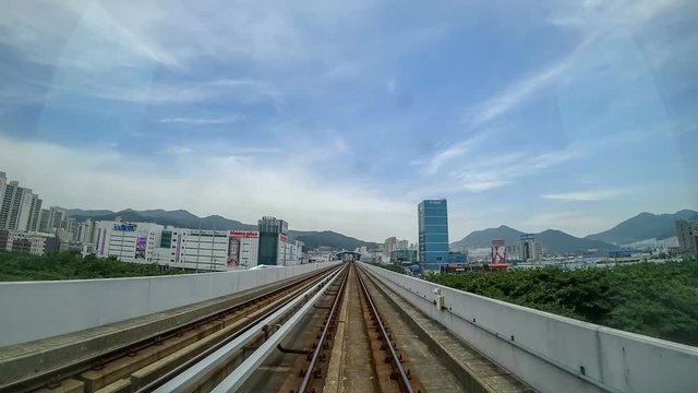SEOUL, KOREA - MAY 29, 2018: Timelapse of Riding at Light Railway Through the City. Point of View