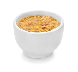 Dijon mustard in bowl on white background