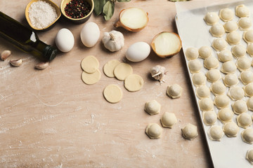 Fototapeta na wymiar Process of making dumplings with meat on wooden table