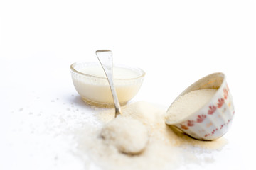 Entire ingredients for Suji ka halwa isolated on white  including sugar.
