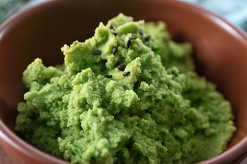 Fresh guacamole in bowl, closeup