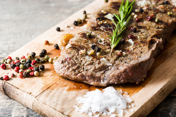 Grilled beef steak and spicy on rustic wooden background