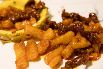 Sweet and sour chinese pork served in pineapple