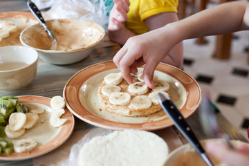 Cooking class, culinary. Food and people concept, child hands in process cooking of sweet cake.