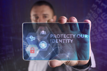 The concept of business, technology, the Internet and the network. A young entrepreneur working on a virtual screen of the future and sees the inscription: Protecty our identity