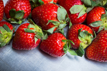 Ripe strawberries on the rustic background. Selective focus.